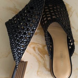 Women’s Nine West slip on black flat shoes.
